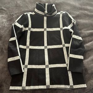 Metric Turtleneck size large fits medium too nice on, warm and comfortable